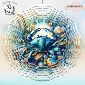 May include: A layered, circular wind spinner featuring a vibrant blue crab design. The crab is surrounded by seashells, flowers, and a wooden plank, set against a coastal backdrop. The design includes the text "Freebies Included".