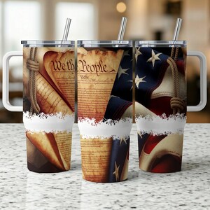May include: Three stainless steel tumblers with lids and straws. The tumblers feature a design of the American flag and the text "We the People" from the US Constitution.