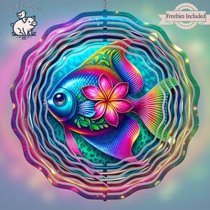 May include: A colorful metal wind spinner featuring a rainbow fish with a pink flower. The fish is surrounded by a series of concentric circles, creating a mesmerizing optical illusion.