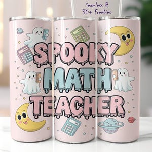 May include: Pink stainless steel tumbler with a spooky math teacher design. It features ghosts, calculators, and moons with spooky faces. The text "Spooky Math Teacher" is written in a dripping font.