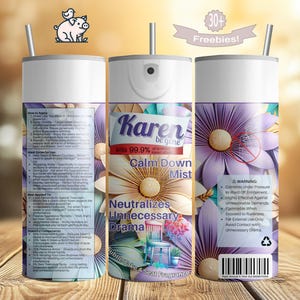 May include: A white and silver spray bottle with the text "Karen be gone Calm Down Mist" and floral designs. The bottle is decorated with purple and cream-colored flowers. The product claims to neutralize unnecessary drama.