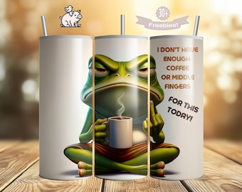 May include: A green frog with a grumpy expression sits cross-legged, holding a coffee mug. The mug has steam rising from it. The text on the mug reads "I don't have enough coffee or middle fingers for this today!"