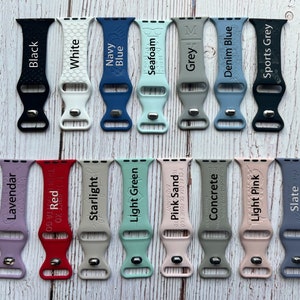 May include: A set of 20 silicone watch bands in various colours, including black, white, navy blue, seafoam, grey, denim blue, sports grey, lavender, red, starlight, light green, pink sand, concrete, light pink, and slate. Each band has a different colour and a different text label.
