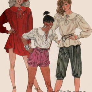 May include: A McCall's sewing pattern envelope featuring illustrations of three outfits: a red long-sleeved dress, a white blouse with pink shorts, and a white blouse with dark striped cropped trousers. The text reads McCall's and Liz Claiborne.