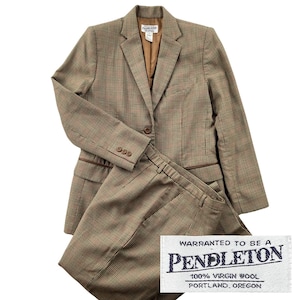 May include: A tan and brown houndstooth blazer and matching trousers set. The blazer features a notched lapel, a single button closure, and three buttons on each cuff. A white label reads: WARRANTED TO BE A PENDLETON 100% VIRGIN WOOL PORTLAND, OREGON.