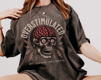 overstimulated graphic tee | dark humor tee | trendy aesthetic skeleton comfort colors tee |