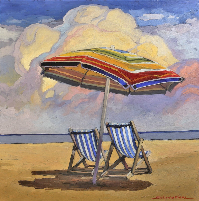 May include: Two striped beach chairs sit under a colorful striped umbrella on a sandy beach. The sky is blue with a large white cloud.