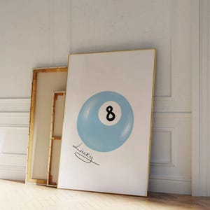May include: A blue and white 8-ball with the word "Lucky" written underneath. The 8-ball is on a white background.