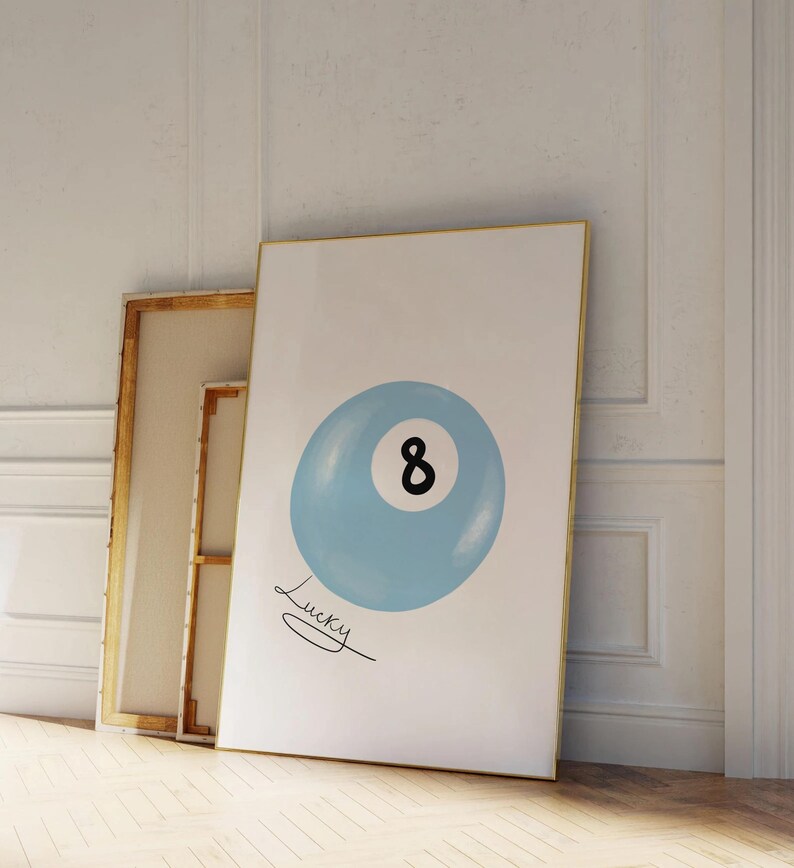 May include: A blue and white 8-ball with the word "Lucky" written underneath. The 8-ball is on a white background.