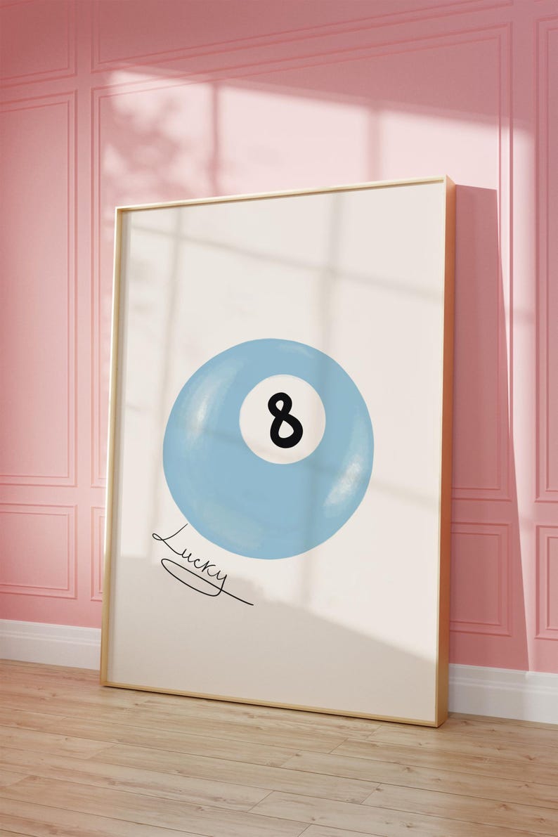 May include: A blue and white illustration of a pool ball with the number 8 on it. The text "Lucky" is written below the ball.