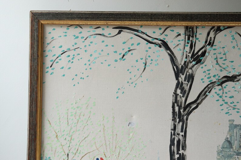 May include: A framed painting depicting a stylized landscape with a large tree in the center. The tree has a black trunk and branches with green leaves. The background is a light gray with hints of green and white.