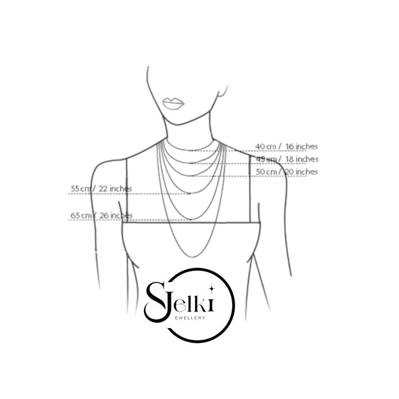 The image is a drawing of a person's neckline with measurements and a logo for a jewelry brand.