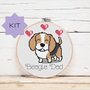 May include: Cross stitch kit featuring a cartoon beagle with three red hearts above it. The text "Beagle Dad" is below the beagle.