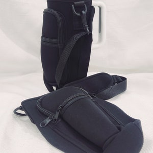 May include: Two black neoprene insulated beverage holders with zippered pockets and adjustable straps. One holder has a white handle.