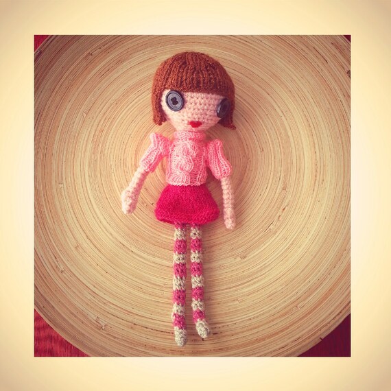 doll with pink hair and button eyes