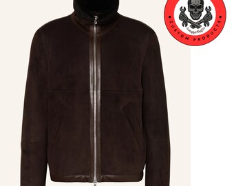 May include: A brown suede bomber jacket with a black shearling collar and zipper closure.