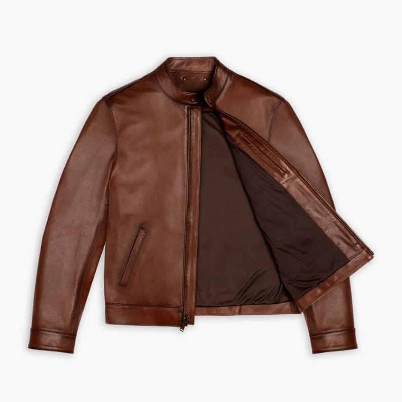May include: A brown leather jacket with a zipper closure and a stand-up collar.
