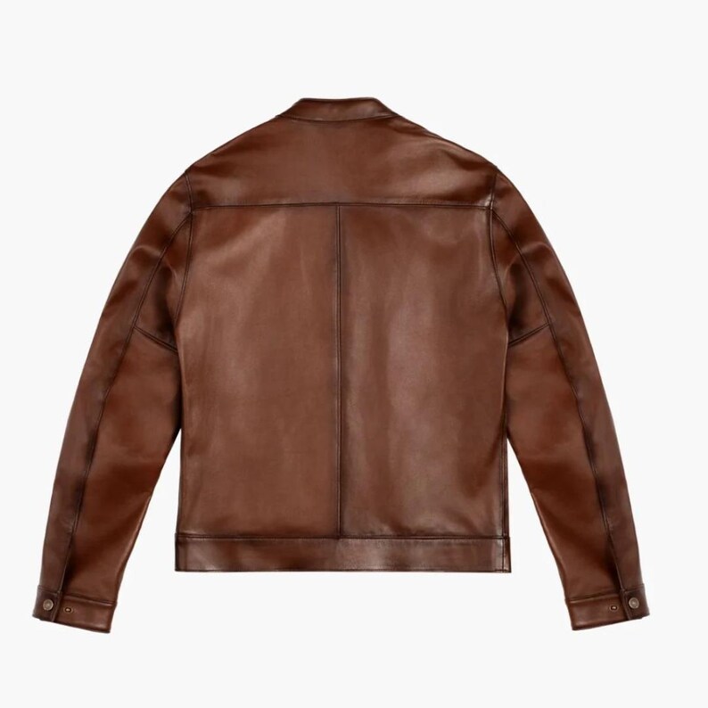 May include: A brown leather jacket with a zipper closure and a stand-up collar.
