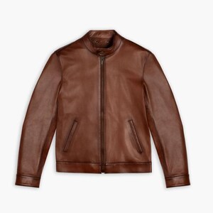 May include: A brown leather jacket with a zipper closure and two pockets on the front.