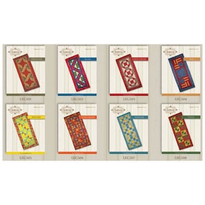 May include: A collection of eight quilt pattern designs, each featuring a different geometric pattern. The patterns include "Ribbon Star," "Zig Zag," "Garden Square," and "Flag." Each design is displayed on a rectangular card with the Legacy logo.
