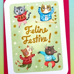 Feline Festliche Katzenkarte - süße Weihnachtskarte Katzen hässliche Pulloverkarte Frohe Feiertagskarte Gruß Niedliche Katzen im Pullover Karte Feiertagskarte Wortspiele