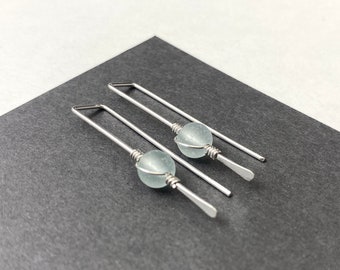 Simple sterling silver minimalist wire stick earrings with light green glass bead