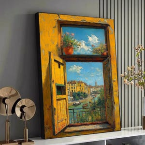 May include: A framed painting of a yellow window frame with open shutters, displaying a scenic cityscape. The artwork features a blue sky with clouds, potted flowers, and a river scene with buildings and boats. The painting conveys a sense of travel and art.