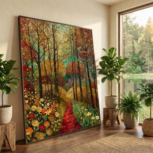 Può includere: Grande stampa artistica incorniciata raffigurante una colorata scena di foresta. L'opera presenta un sentiero rosso che si snoda tra alberi con foglie dorate, arancioni e verdi. Il dipinto è esposto in una stanza luminosa con piante e vista su un lago.