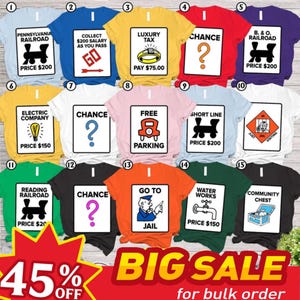 May include: A collection of fifteen t-shirts in various colors, each featuring a different Monopoly board game square graphic with text such as Pennsylvania Railroad, Luxury Tax, Chance, Free Parking, Go To Jail, and Community Chest.