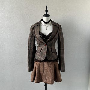 Koreanskt märke brun damkavaj med axelvaddar vintage