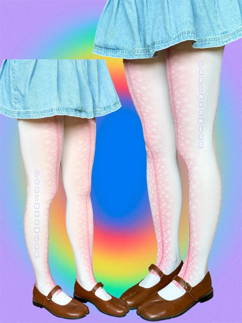 May include: White tights featuring a pink gradient deer-like spotted pattern and the vertical text DARINKAWEAR in light blue. The tights are paired with a light blue denim skirt and brown leather Mary Jane shoes with a buckle strap closure.