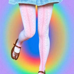 May include: White and pink patterned tights with the text "DARINKAWEAR" in white, paired with brown split-toe Mary Jane shoes. The background features a rainbow gradient against a purple backdrop, creating a vibrant aesthetic.