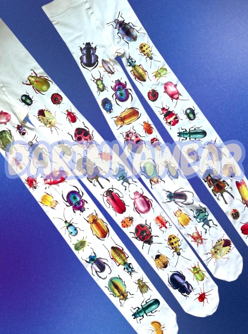May include: White tights featuring a repeating pattern of various colorful beetles and insects in shades of red, green, blue, yellow, and metallic tones. The fabric is printed with a diverse array of beetle species across the entire length.