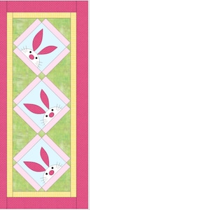 May include: A colorful Easter-themed quilt featuring three bunny faces. Each bunny is set in a light blue diamond shape with pink ears and a white face. The quilt has a pink polka-dot border and a green and yellow background.