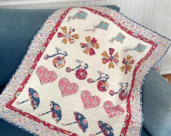 Applique' Baby Quilt Pattern, row-by-row appliqué, measuring 31" x 37", perfect for crib size.