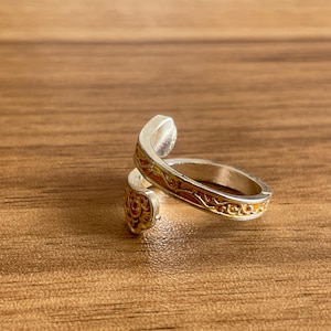 a couple of rings sitting on top of a wooden table