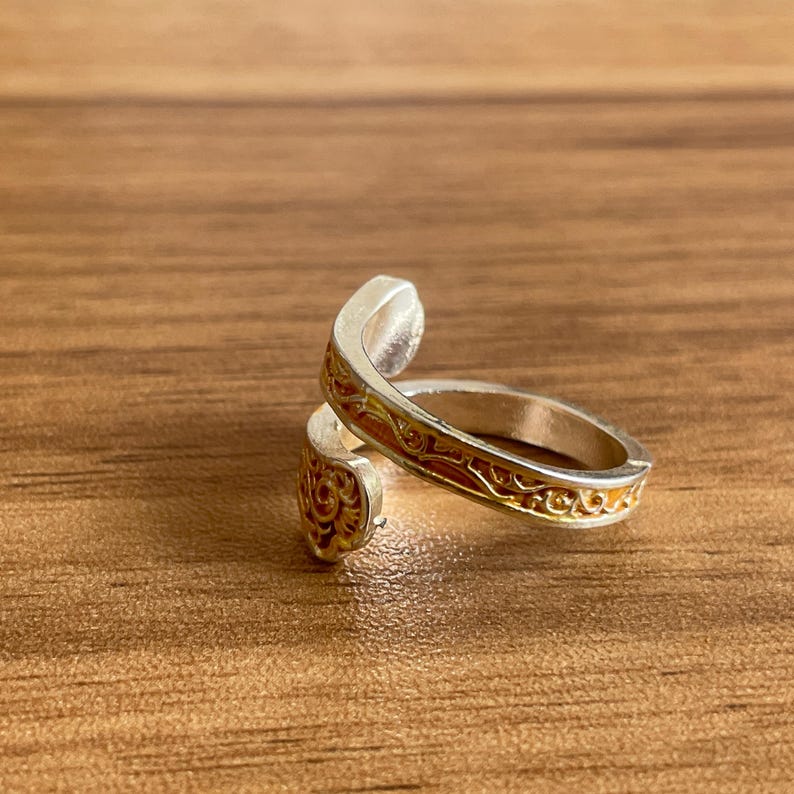 a couple of rings sitting on top of a wooden table