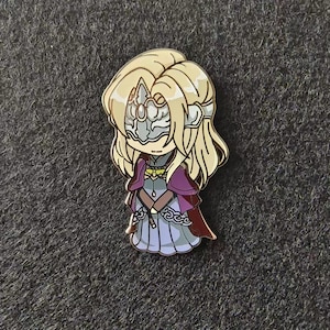 a pin with a cartoon character on it