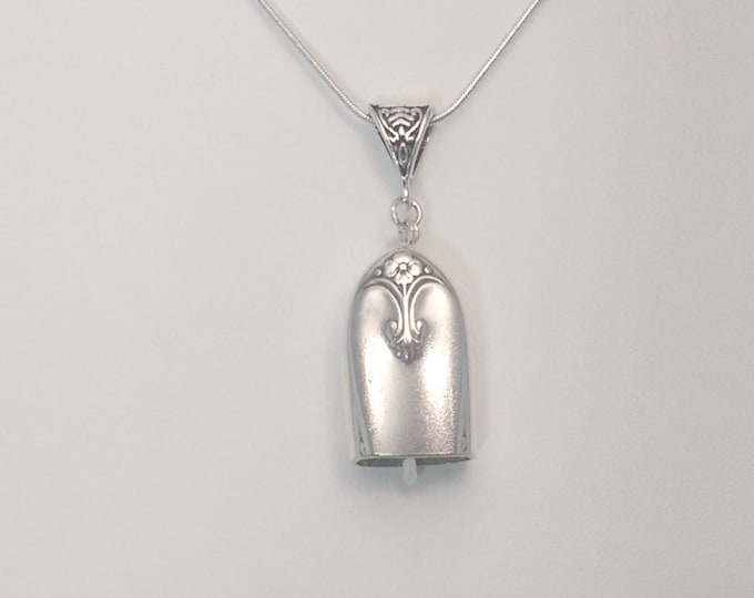 Exquisite 1941 upcycled knife handle bell necklace!