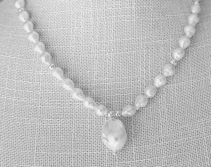 Baby Baroque Pearls and larger Baroque pearl.  Love the look of the baby Baroque pearls !  Elegant and simple!