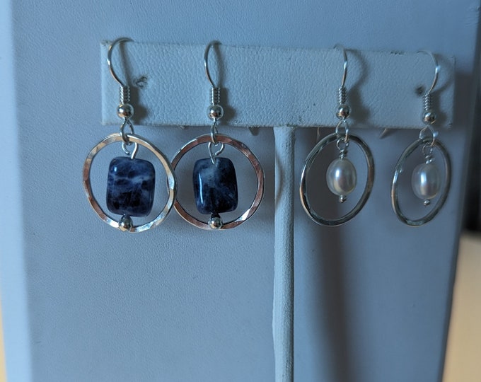Hammered Sterling circle dangles with freshwater pearl or sodalite bead hanging in middle. Sterling silver earwires.