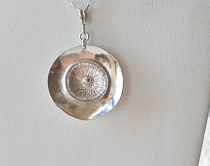 Anemone sterling silver pendant.   Simple yet lovely.