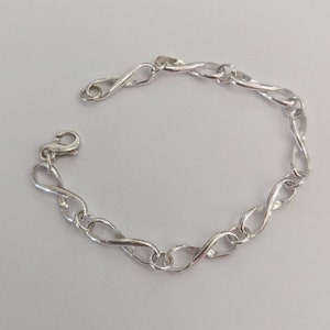 Simplicity! Sterling Infinity symbol bracelet with figure eight clasp.