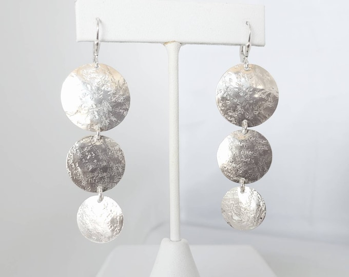 Three textured Sterling discs dangle on french wires.  Three sizes of discs.