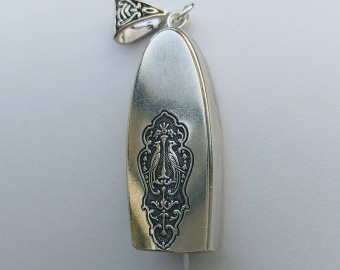 Bird of Paradise 1923 upcycled knife handle bell necklace!