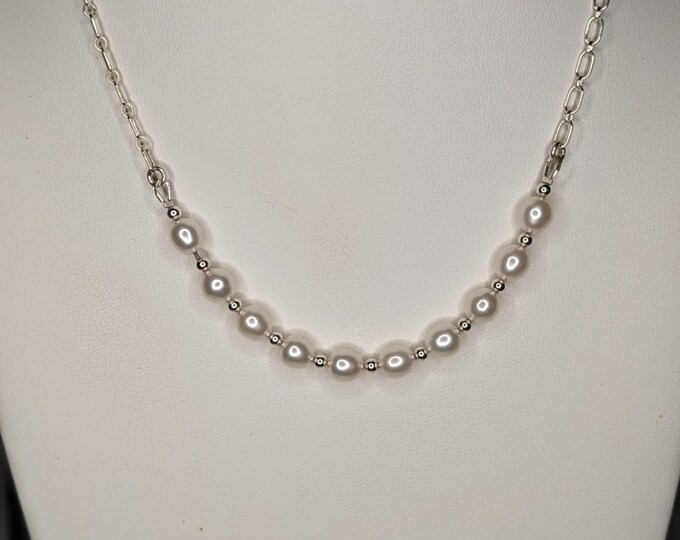 Freshwater pearls and sterling balls centered on open chain.  Necklace adjustable to 20".  Elegant and simple!