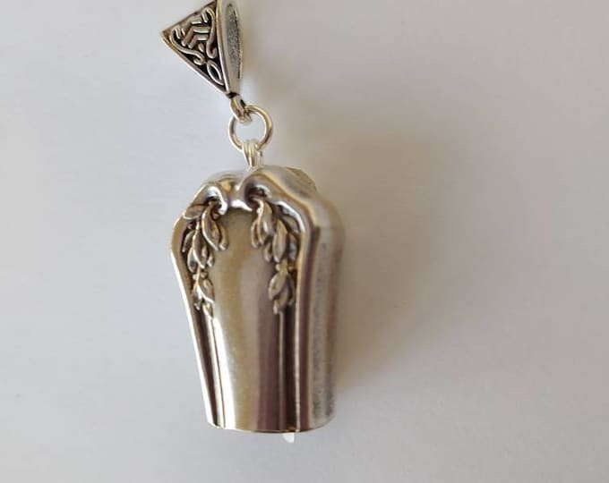 Laurel 1910 upcycled knife handle bell necklace. This has a faint ring.