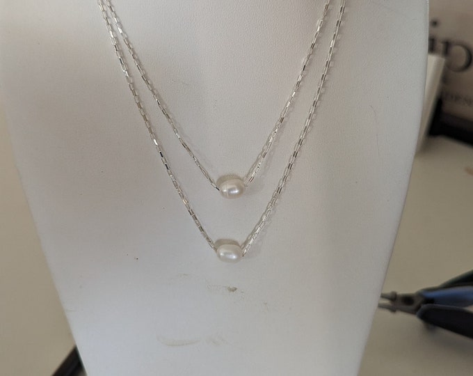 Freshwater pearl floating on sterling open link chain.  Necklace available in 18" or special length . Elegant and simple!