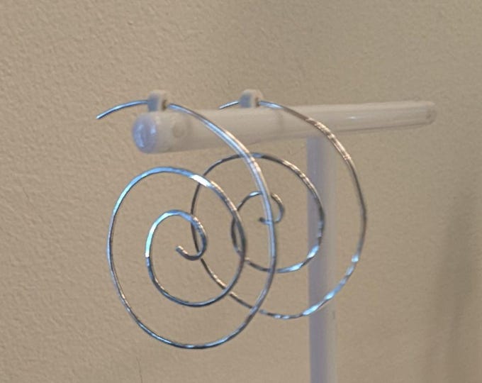Hammered Sterling spiral with self earwire.  Very comfortable and lightweight.
