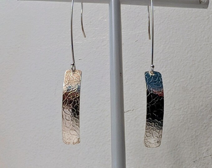 Textured rectangle shape on long earwires.